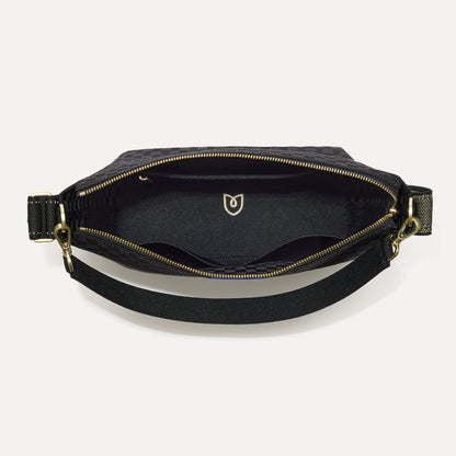 The Mini Zip Bucket in Black Sand shown from the top down, with zipper open and interior exposed.