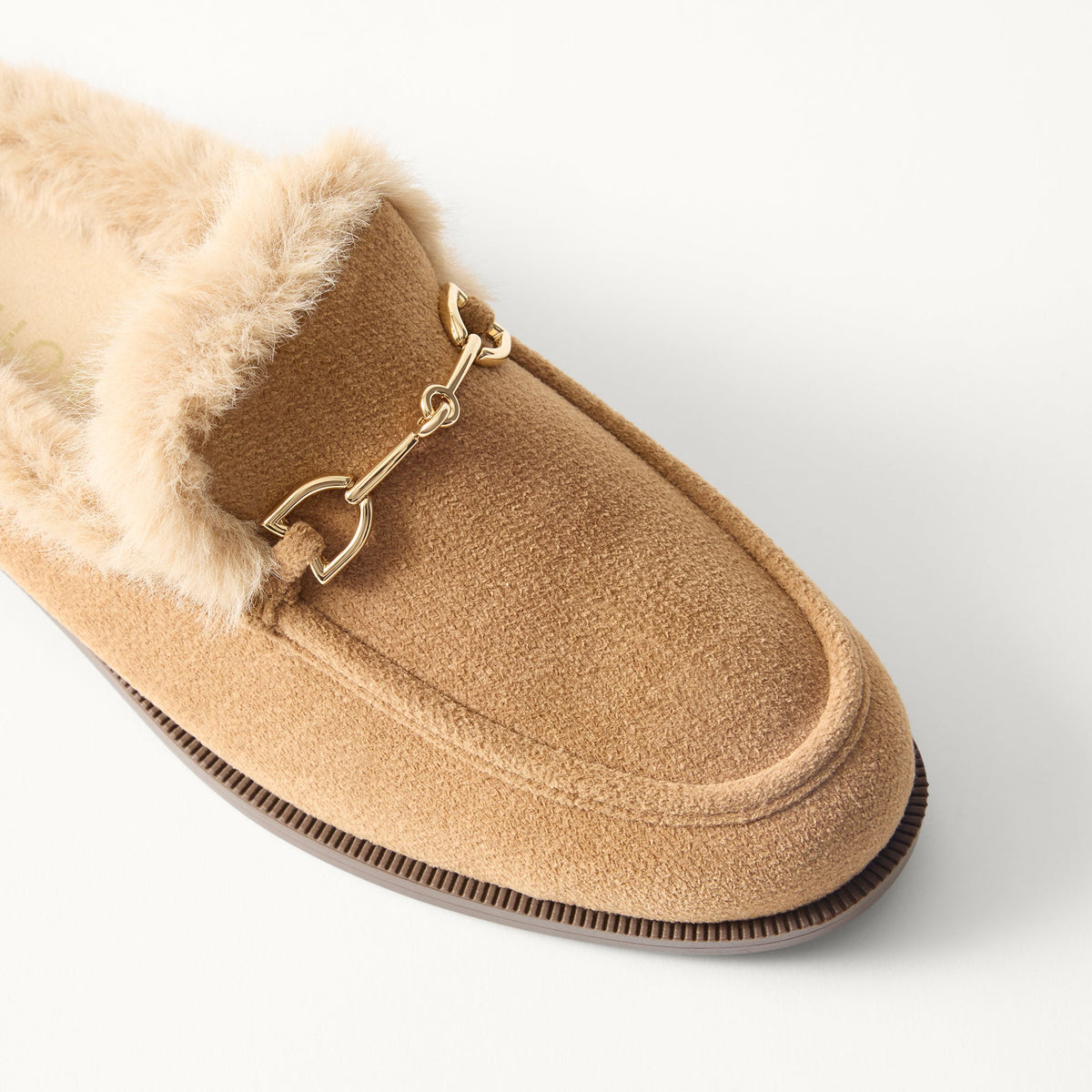 macro | Close up of the toe and vamp of The Après Loafer Mule in ReVelvet Pecan, showing the double bit detail on top.