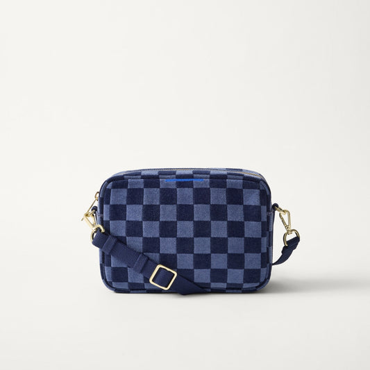 EXT | The Crossbody Camera Bag in ReVelvet™ Blue Ink, shown from the front.
